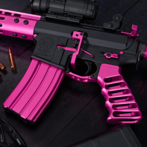 Custom pink and black pistol with gold bullets displayed.