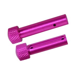 Two magenta anodized AR 5.56 extended takedown pins, knurled and lightweight, from Guntec USA.