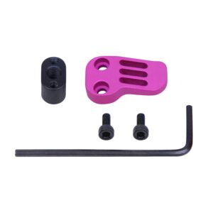 Anodized pink AR-15 extended mag catch paddle with accessories on plain background.