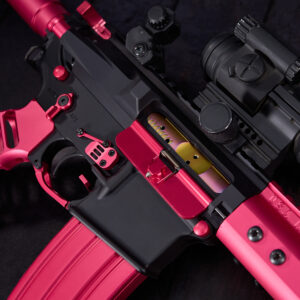 Custom pink and black rifle with scope, detailed with vibrant magazine and opened bolt area.