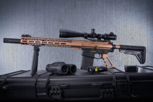 GT-15ALC-308-BRZ tactical rifle with scope and accessories against textured backdrop.