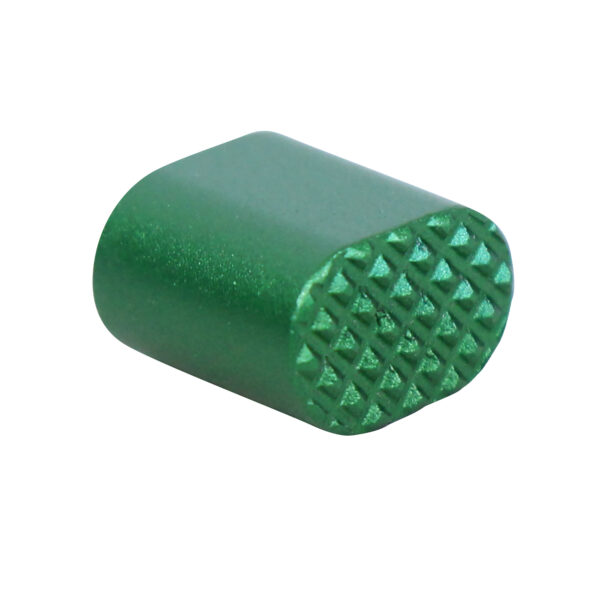 Green anodized AR-15 extended magazine button, showing a textured grip surface.