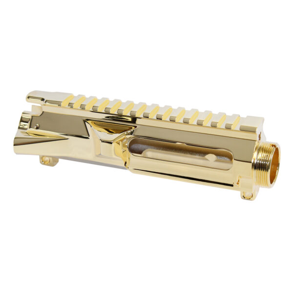 Gold-plated AR-15 billet upper receiver with Picatinny rail and precise machining.