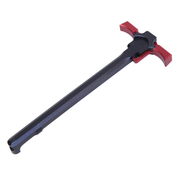 AR-15 ambidextrous charging handle in black with red grips.